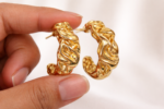 Elegant gold sculptural hoop earring