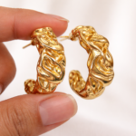 Elegant gold sculptural hoop earring